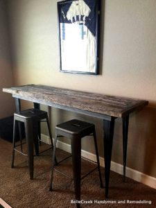 reclaimed wood table with tapered angle iron legs