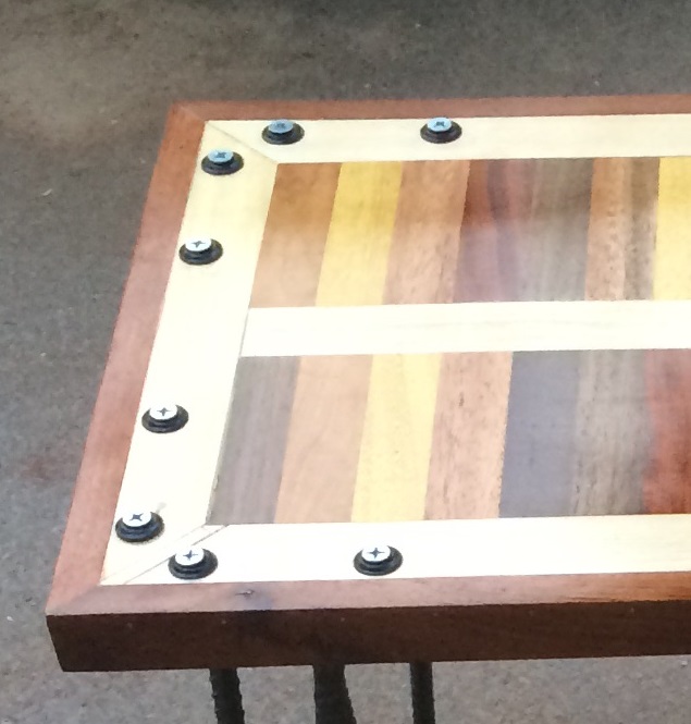 scrap wood table with hairpin legs closeup