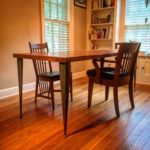 repurposed table with tapered angle iron legs