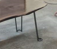 walnut slab tables with just the tip hairpin legs closeup