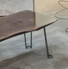 walnut slab tables with just the tip hairpin legs closeup