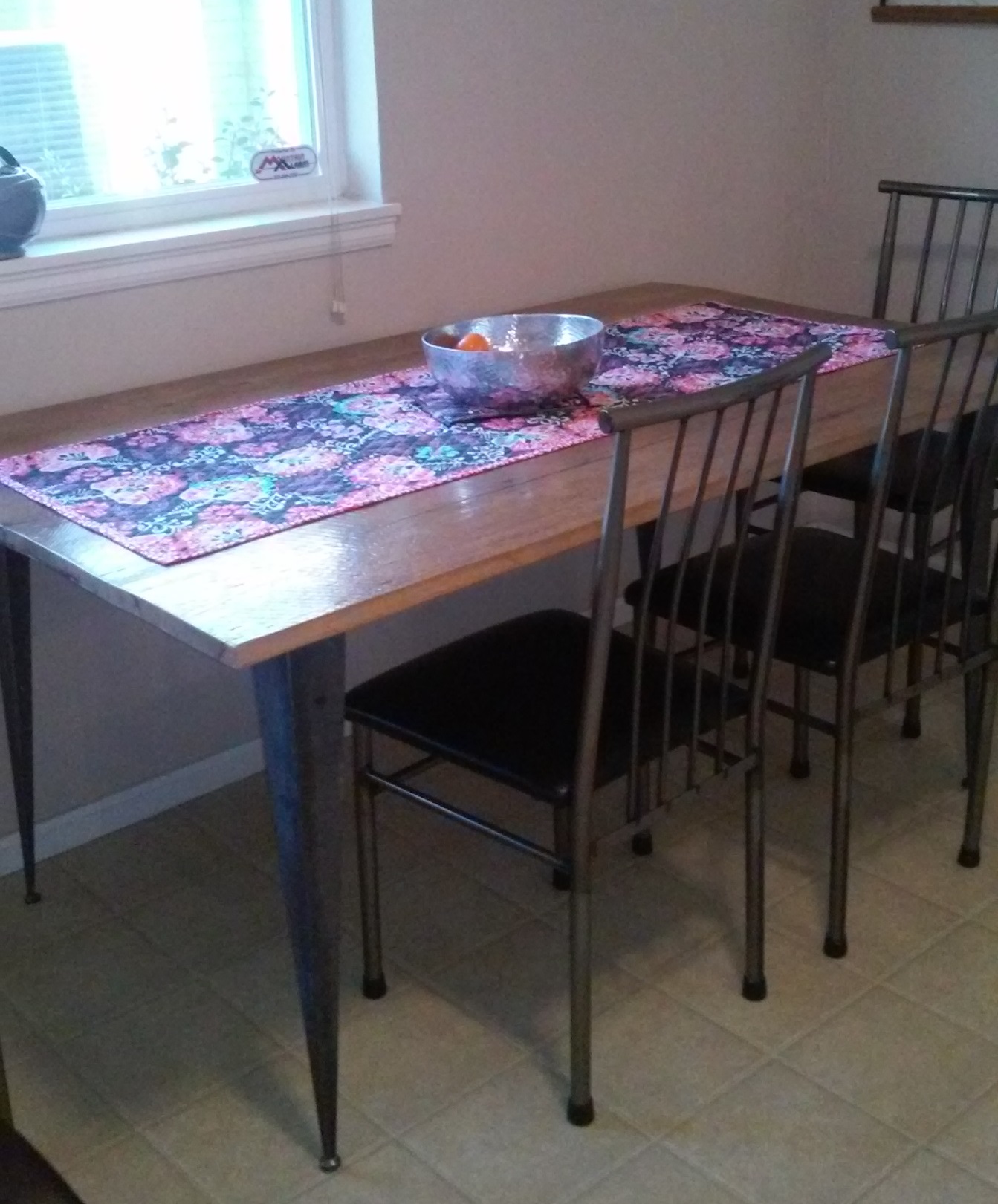 oak table with tapered angle iron table legs