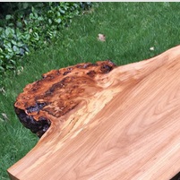 burl side table with twisted hairpin legs closeup