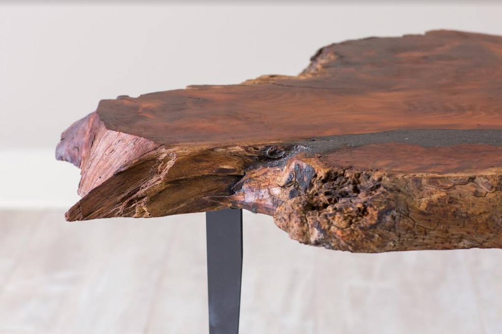 closeup redwood table with angle iron table legs