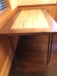 maple and walnut table with metal hairpin table legs